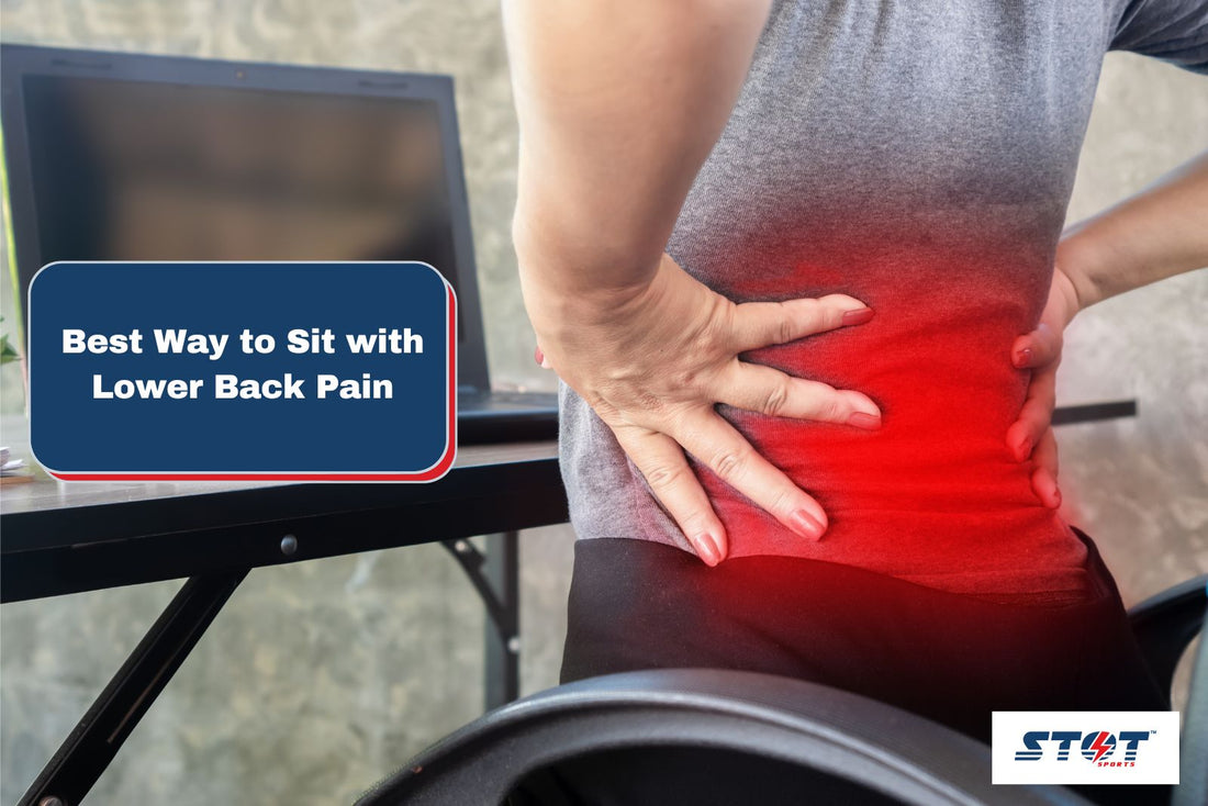 woman suffering with lower back pain while sitting