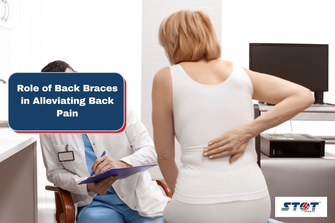 doctor assessing the back pain of the patient